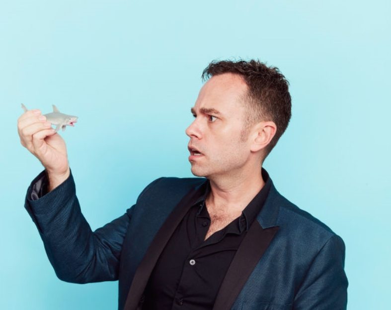 Scott Mullen with shark figurine