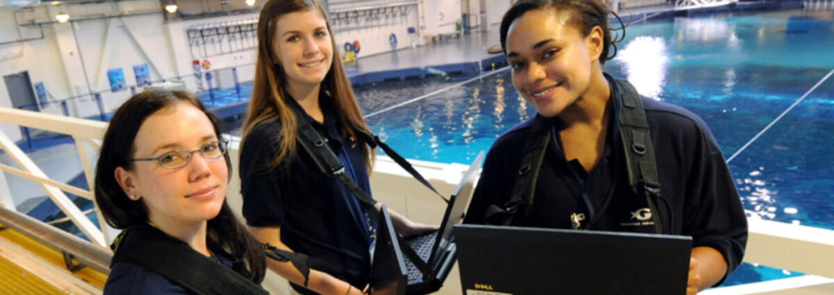 GSU students working above Georgia Aquarium pool
