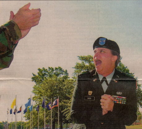 Maj. Gen. Janet Hicks celebrates her promotion as Gen. Kevin Byrnes, the head of the Army's Training and Doctrine Command, applauds her. She was promoted Wednesday at Fort Gordon. ANNETTE M. DROWLETTE/STAFF
